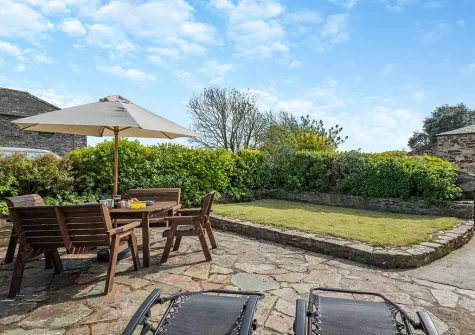 The patio, alfresco dining area & garden at Mallard Cottage, Tregolds
