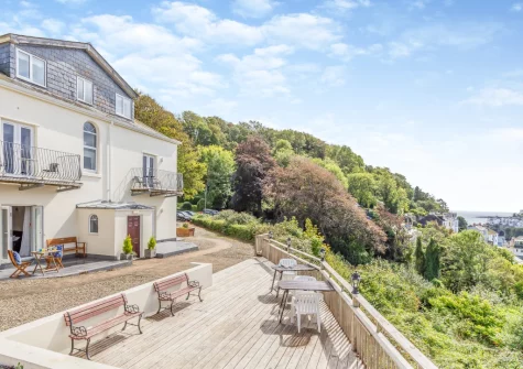 The shared decked patio & outdoor sitting area at Manor House, Looe
