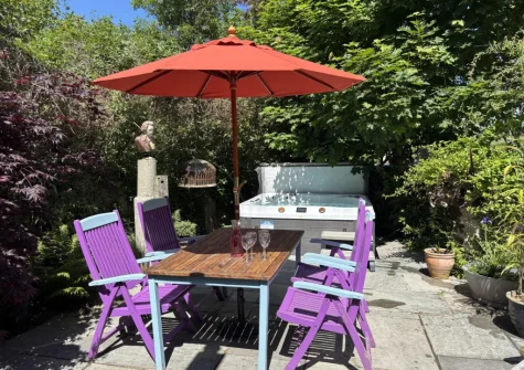 The patio, lfresco dining area & hot tub at Maple Barn, Torrington