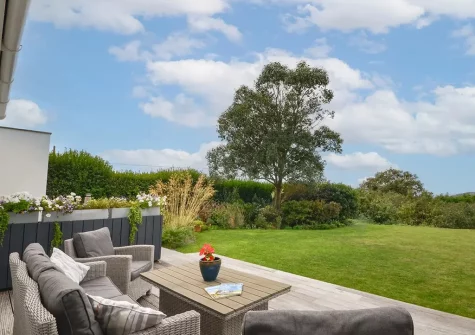 The patio, outdoor sitting area & garden at March House, Wembury