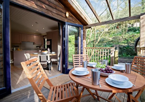 The glass-covered enclosed terrace & alfresco dining area at Margot at Rosehill Lodges, Porthtowan