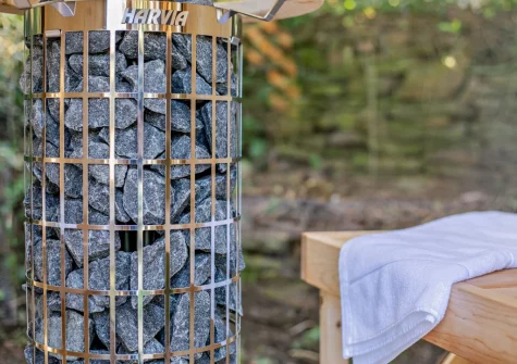 Unwind in the private sauna, overlooking a lush woodland area, at Margot at Rosehill Lodges, Porthtowan