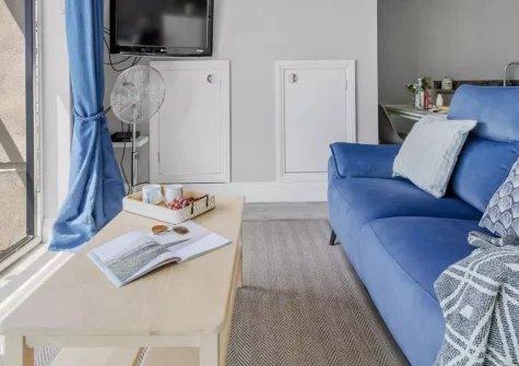 Marina View Suite, Torquay is a stylish second-floor apartment boasting breathtaking Torbay views, a Juliette balcony, and access to communal sea-view gardens, perfectly placed for beaches, harbourside dining and Devon's finest attractions.