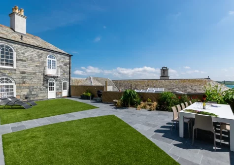 The large enclosed rear garden & alfresco dining area at Marine Villa, Padstow