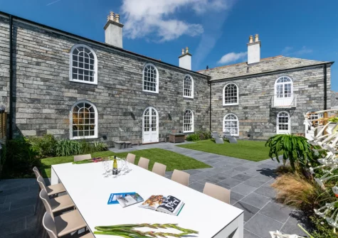 The large enclosed rear garden & alfresco dining area at Marine Villa, Padstow
