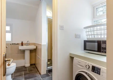 The shower and utility room at Marmaduke Cottage, Fowey