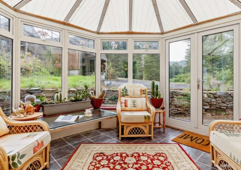 The conservatory living area at Marquis House, Gulworthy