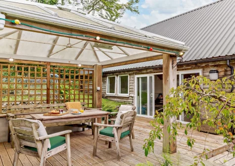 The decked patio, barbecue & alfresco dining area at Marquis House, Gulworthy