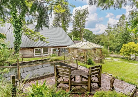 The outdoor sitting area & spacious garden at Marquis House, Gulworthy