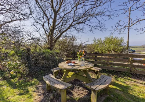 The enclosed private garden & alfresco dining area at Marsland Cottage at Cory Farm, Gooseham