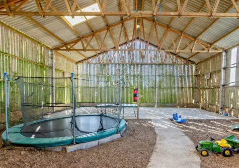 The shared indoor all weather play barn at Marsland Cottage at Cory Farm, Gooseham