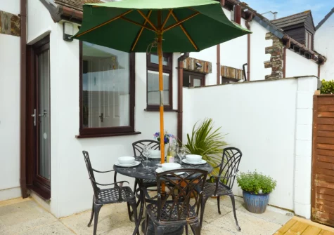 The patio, babecue & alfresco dining area at Mayflower Cottage, Padstow