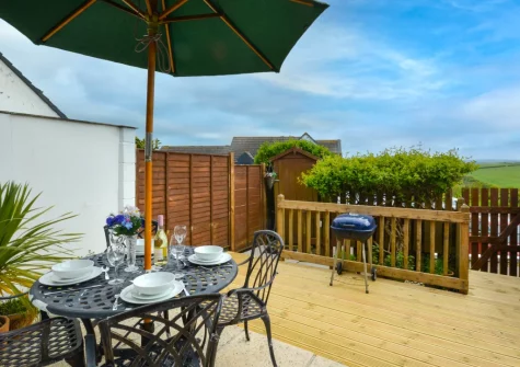 The south-facing patio, babecue & alfresco dining area at Mayflower Cottage, Padstow