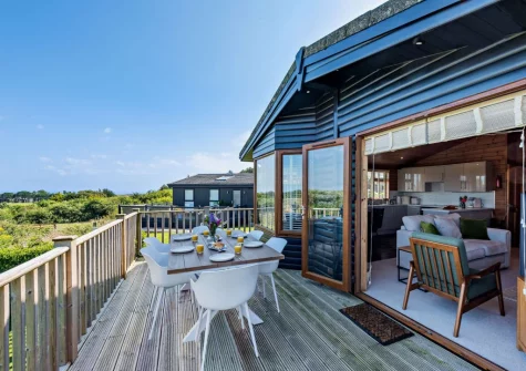 The wrap-around decked terrace & alfresco dining area at Meadow View Eleven, Mullacott