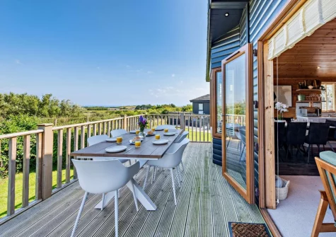 The wrap-around decked terrace & alfresco dining area at Meadow View Eleven, Mullacott