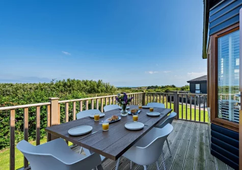 The wrap-around decked terrace & alfresco dining area at Meadow View Eleven, Mullacott