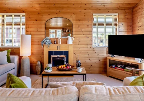 Meadow View Eleven, Mullacott is a beautifully presented three-bedroom lodge set in peaceful North Devon countryside, featuring wrap-around decking with rolling views, luxurious interiors, and easy access to award-winning beaches and coastal walks.