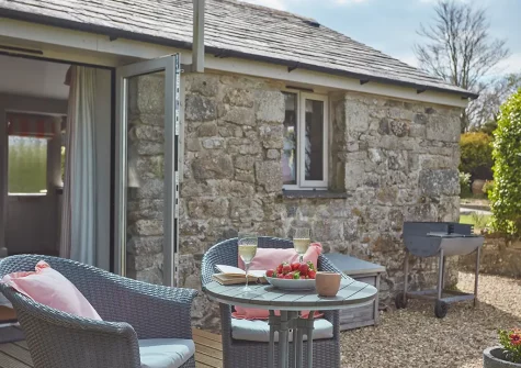 The decked patio, alfresco dining area & garden at Meadow View, Trebudannon