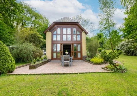 The patio, alfresco dining area & large garden at Meadowside Barn, Meshaw