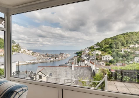 The far reaching view, across the river to the sea beyond, from the living room at Meadowsweet, Looe