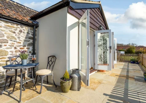 The patio & outdoor sitting area at Medlar's Cott, Tytherleigh