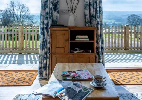 Medlar's Cott, Tytherleigh is a charming one-bedroom cottage with vaulted ceilings, exposed beams, and glorious valley views. A sun-trap patio and super-king bed complete this enchanting Devon retreat, perfectly placed for exploring three counties.
