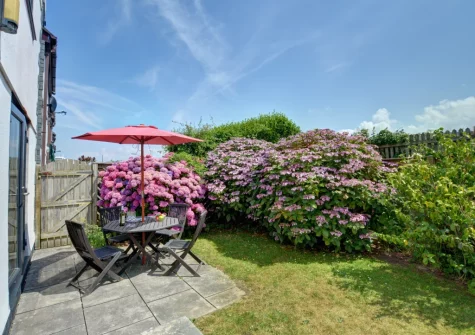 The patio, alfresco dining area & garden at Mena-Gwins, Padstow