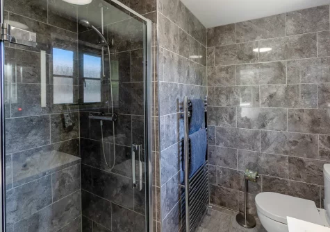 Bedroom #1 en-suite shower room at Merlin Lodge, Winnard's Perch