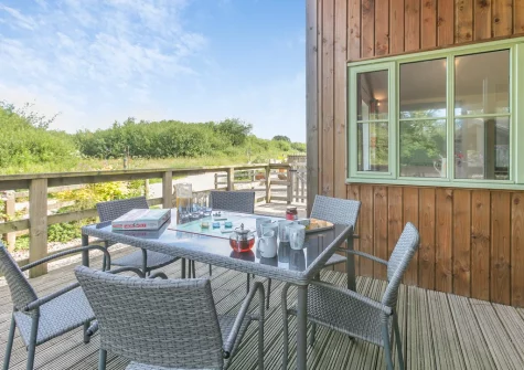 The decked terrace & alfresco dining area at Merlin Lodge, Winnard's Perch