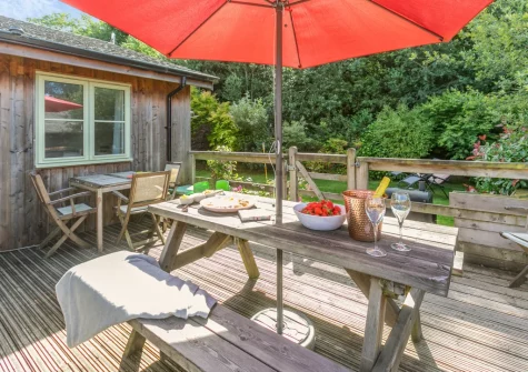 The decked terrace & alfresco dining area at Merlin Lodge, Winnard's Perch