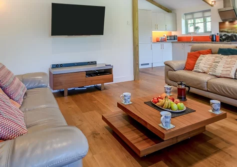 Merlin Lodge, Winnard's Perch is a charming three-bedroom retreat set amid North Cornwall's countryside, with private coarse fishing lakes, a sunny enclosed garden, and easy access to Newquay's beaches and Padstow's charming harbourside.