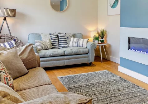Mermaids, Croyde is a stunning detached house featuring a luxurious hot tub and breathtaking sea views. Enjoy beautiful oak floors, modern amenities, and easy beach access for the perfect North Devon coastal escape with family and friends.