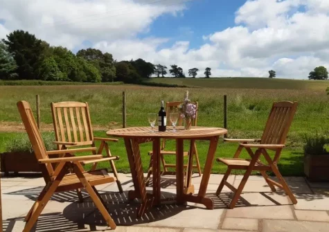 The patio & outdoor sitting area at Merry Barn, Payhembury