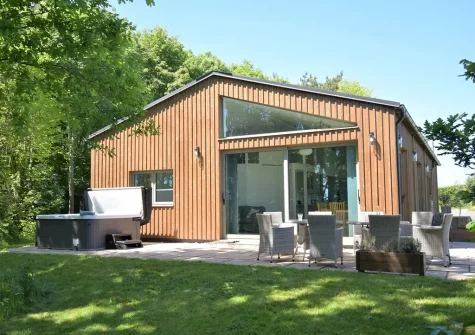 The patio, alfresco dining area, hot tub & garden at Merry Barn, Payhembury