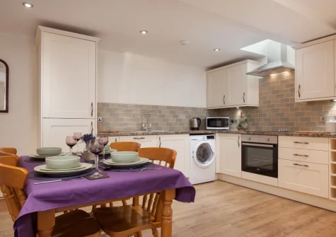 The kitchen & dining area at Mill Cottage, Cockington Village, Torquay