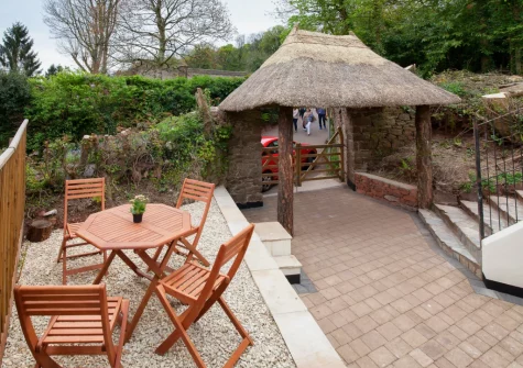 The patio garden & outdoor sitting area at Mill Cottage, Cockington Village, Torquay