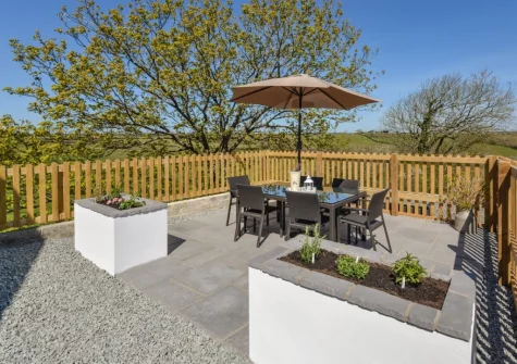 The patio, barbecue & alfresco dining area at Mill View Cottage, Sutcombe