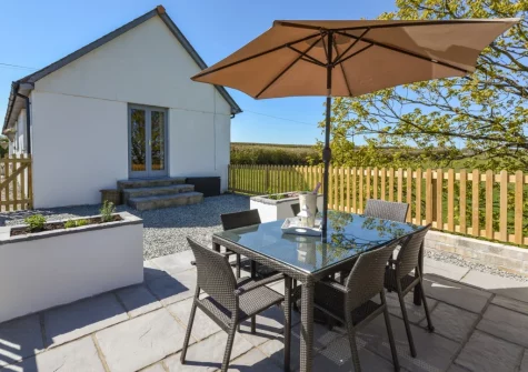 The patio, barbecue & alfresco dining area at Mill View Cottage, Sutcombe