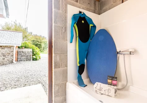 The utility room with bespoke indoor dog & surfbaord shower at Mill View Cottage, Sutcombe
