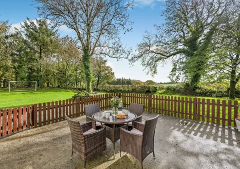 The enclosed patio, alfresco dining area & lawned garden at Millpond Stables, Clawton