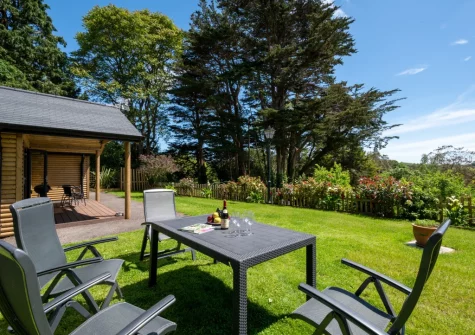 The alfresco dining area & garden at Mimosa, Polsue Gardens, Tresillian