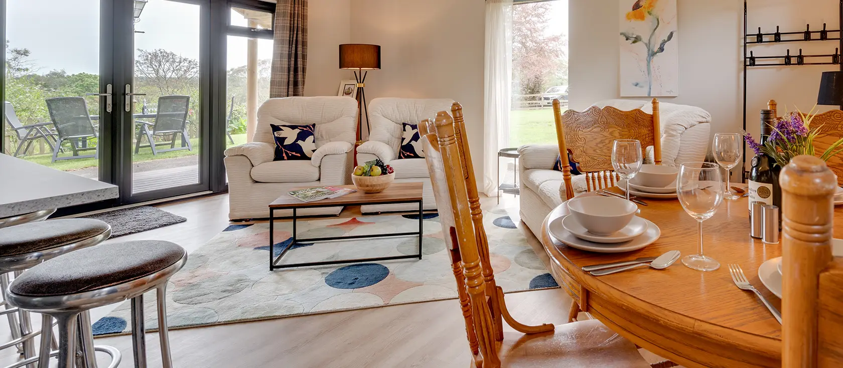 Mimosa, Polsue Gardens, Tresillian is a stylish wooden bungalow in Cornwall's countryside. Enjoy industrial-chic interiors, French doors to gardens, and access to Truro's historic cathedral, beautiful coastlines, and family attractions nearby.