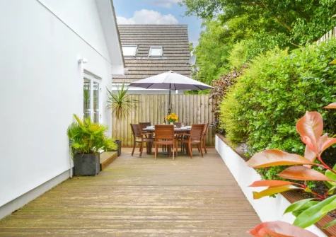 The decked patio, barbecue & alfresco dining area at Minnows, Tregolds