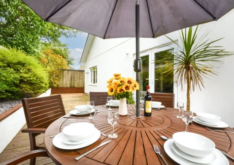 The decked patio, barbecue & alfresco dining area at Minnows, Tregolds