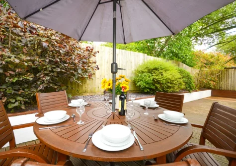 The decked patio, barbecue & alfresco dining area at Minnows, Tregolds