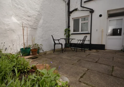 The shared patio, barbecue & outdoor sitting area at Missioners Cottage, Appledore