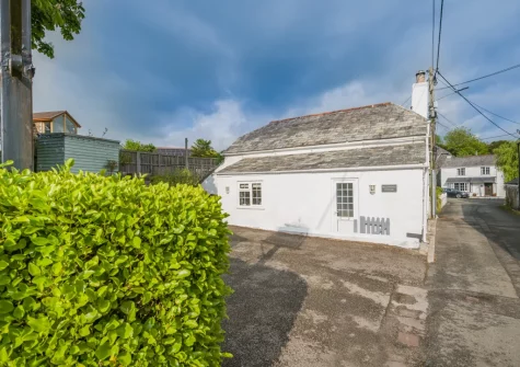 Molesworth Cottage features a welcoming wood burner, exposed stonework, a stylish roll-top bath, original timber beams and parking for one car