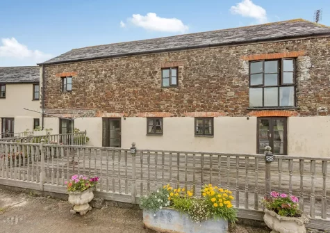Monks Treasure is a semi-detached barn conversion with private hot tub & games room set on a 200 acre working farm