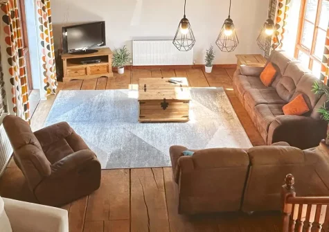 Monks Treasure, Yeomadan is a charming barn conversion for eight guests with private hot tub, games room featuring full-sized snooker table, and farm activities. Perfect for families seeking authentic rural escapes near Devon-Cornwall's coastline.