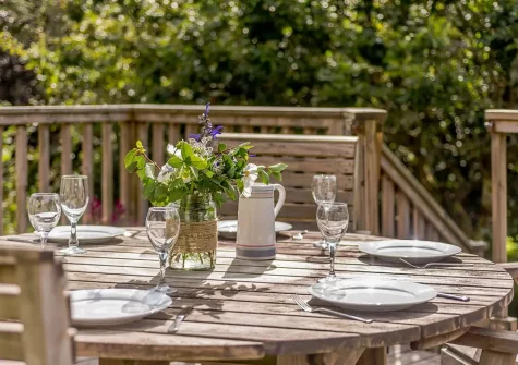 The decked patio & alfresco dining area at Monterey Lodge, Forest Lakes, Woolfardisworthy
